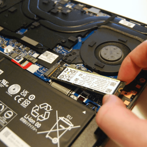 SSD upgrade being installed in a laptop